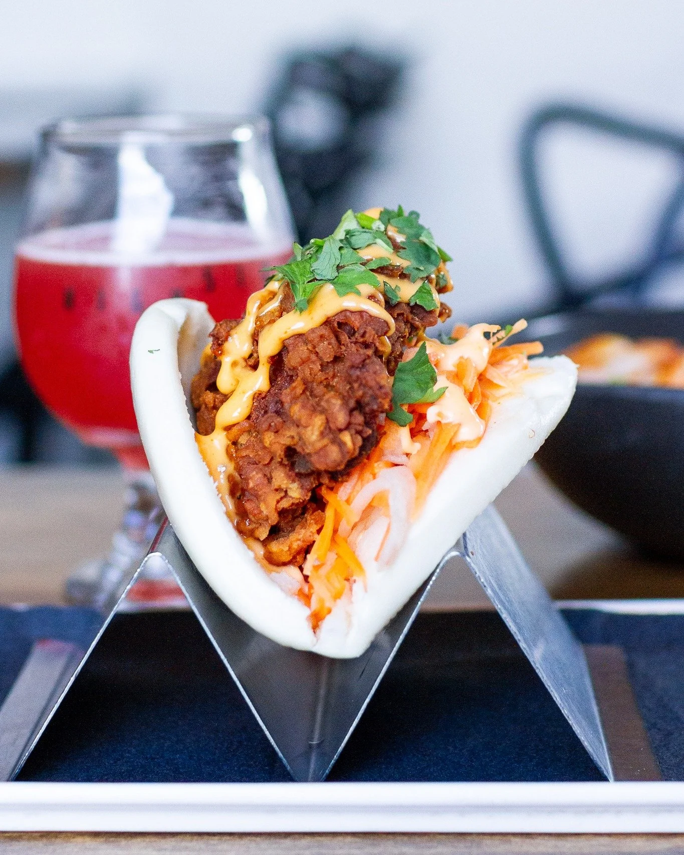 Soft and fluffy on the outside. Crispy and crunchy on the inside.
That's how we Bao at High Side!

Our Fried Chicken Bao starts with a soft, pillowy bao stuffed with crispy fried chicken, topped with creamy Sriracha mayo and tangy pickled daikon and 
