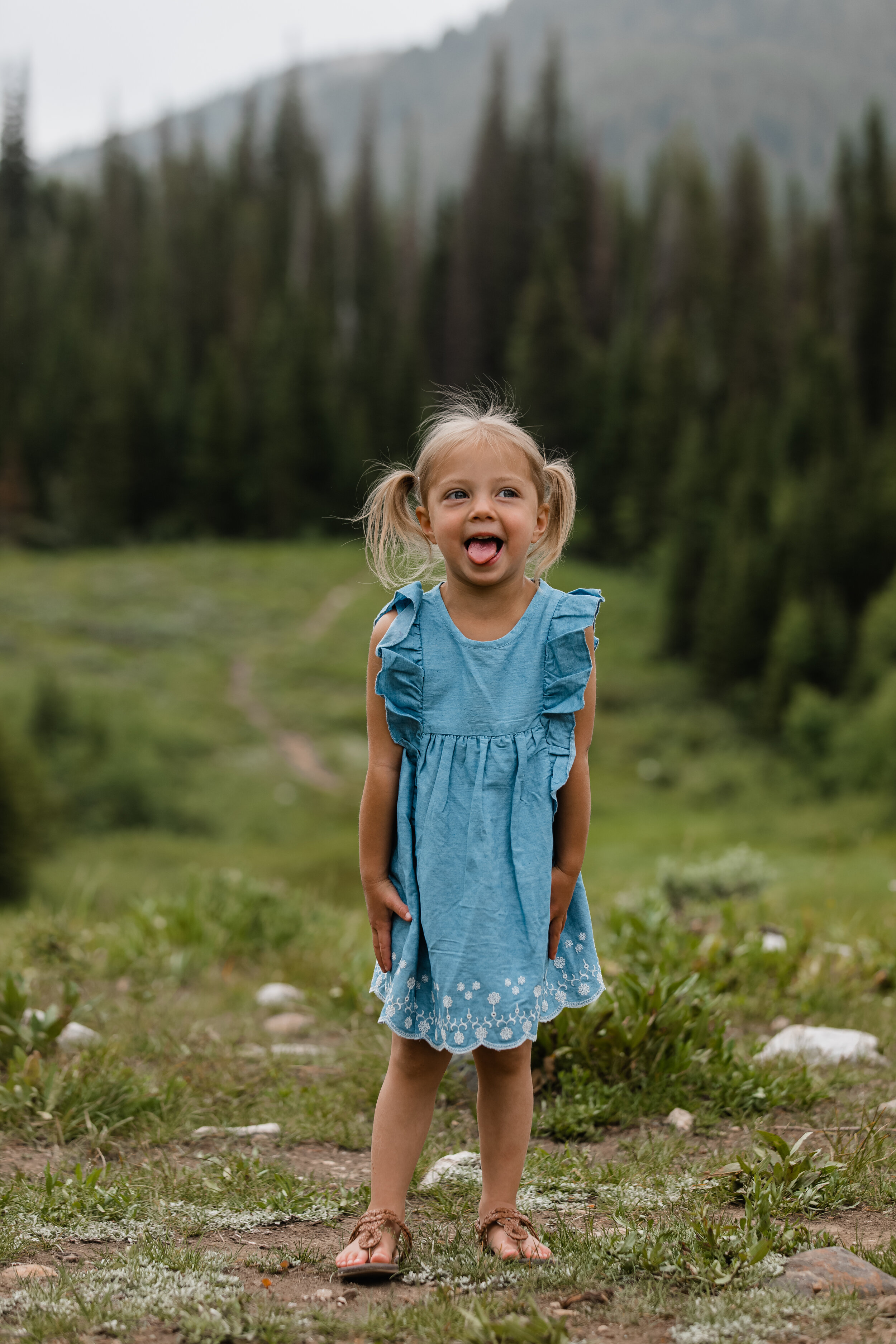 Granddaughter portrait during family photos up big cottonwood canyon at donut falls trailhead