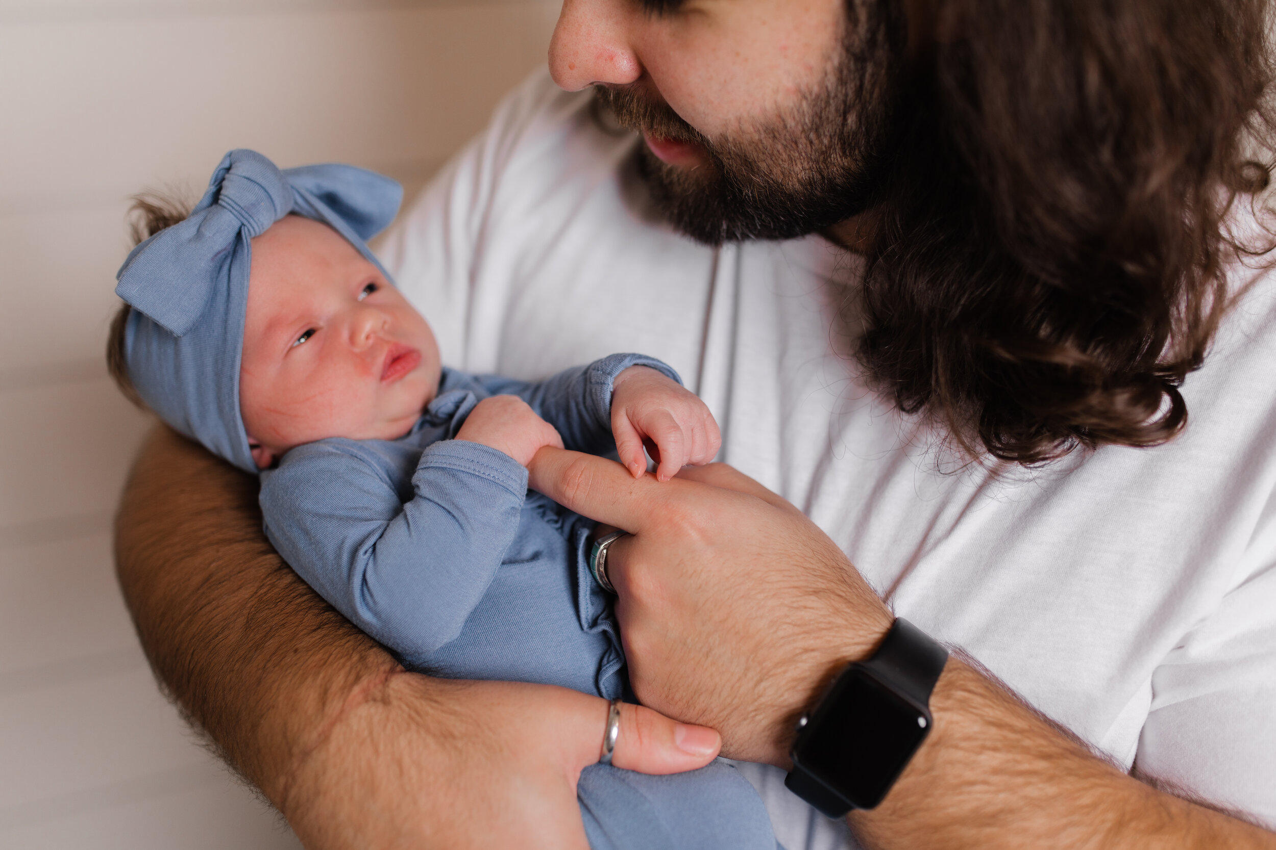 Father holds his newborn baby in draper Utah 
