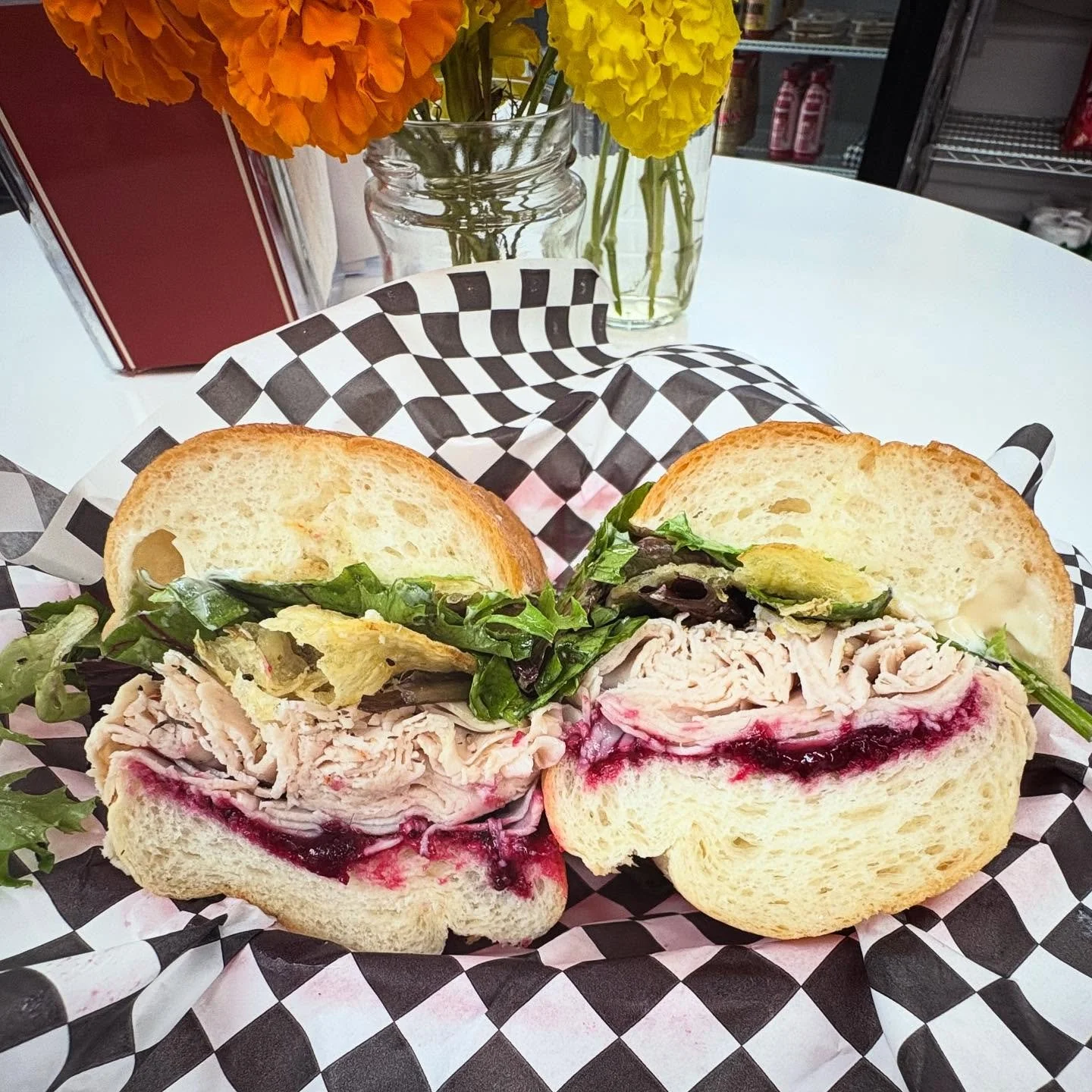 We&rsquo;re rolling out our Holiday Sandwich - since apparently it&rsquo;s already the holiday season 🤯 House made cranberry sauce topped with thinly sliced roasted turkey, lemony herb vinaigrette dressed mixed greens, mayo - and potato chips for a 