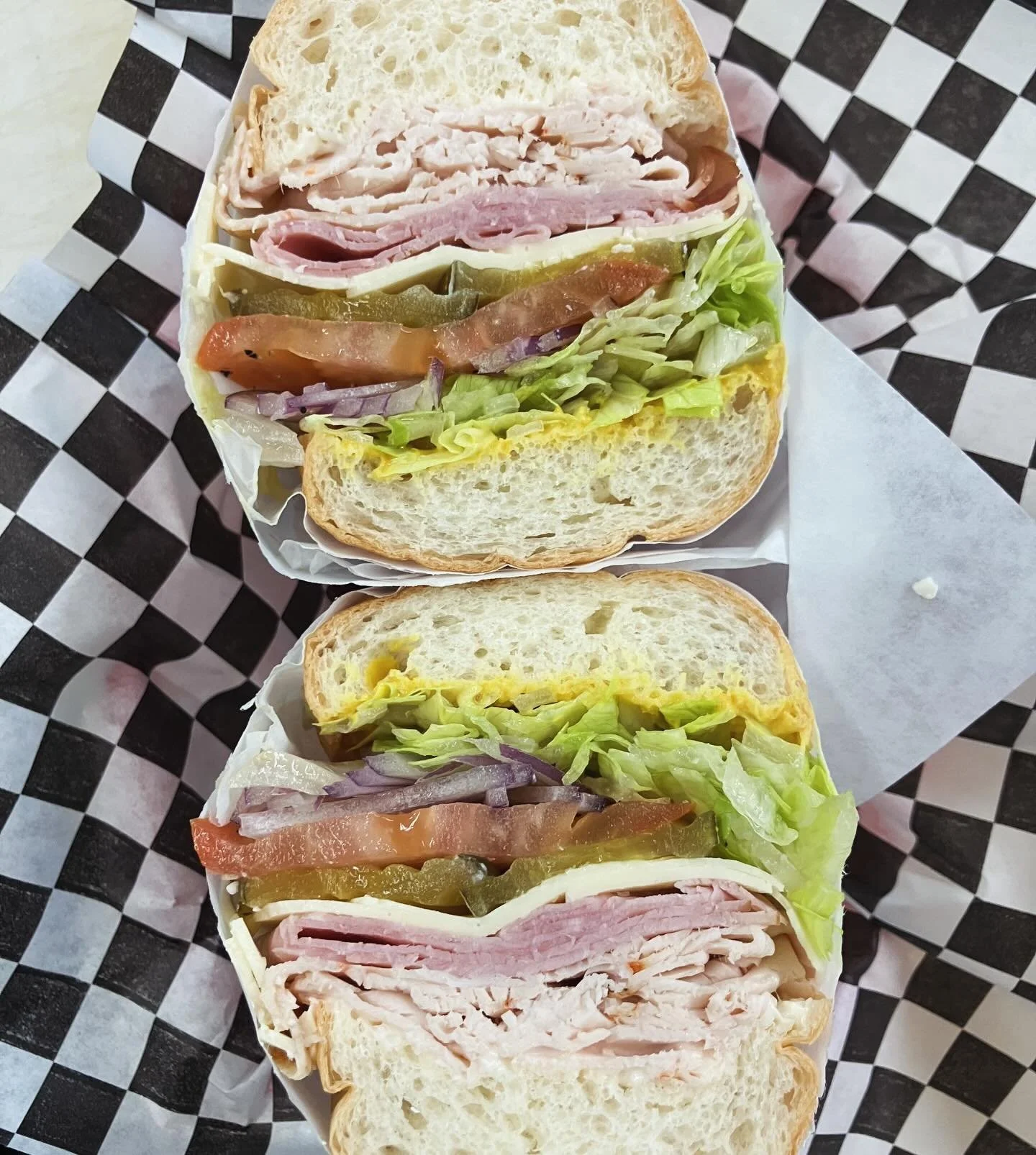 Hungry? Tired of leftovers? Come and grab a sandwich! Like this Country Deli Club: ham, turkey, American cheese, lettuce, tomato, onions, pickles, mustard &amp; mayo - it always hits the spot. 

Order in store or online - the link is in our bio. 

#c