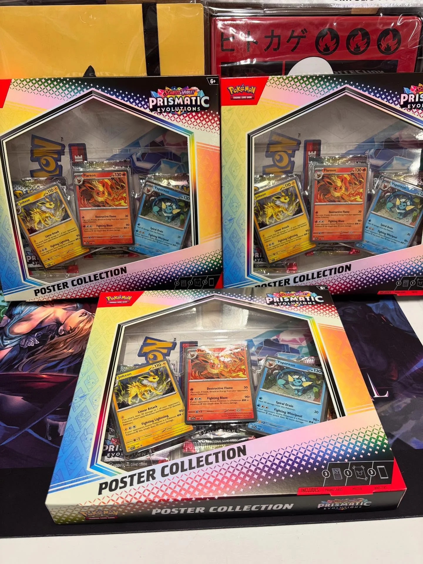 Small restock and got some new accessories in! Prismatic Evolutions poster collection in stock! For Poke accessories we have new binders, deck boxes sleeves and playmats! For our MTG players we have some of the new commander series mats in featuring