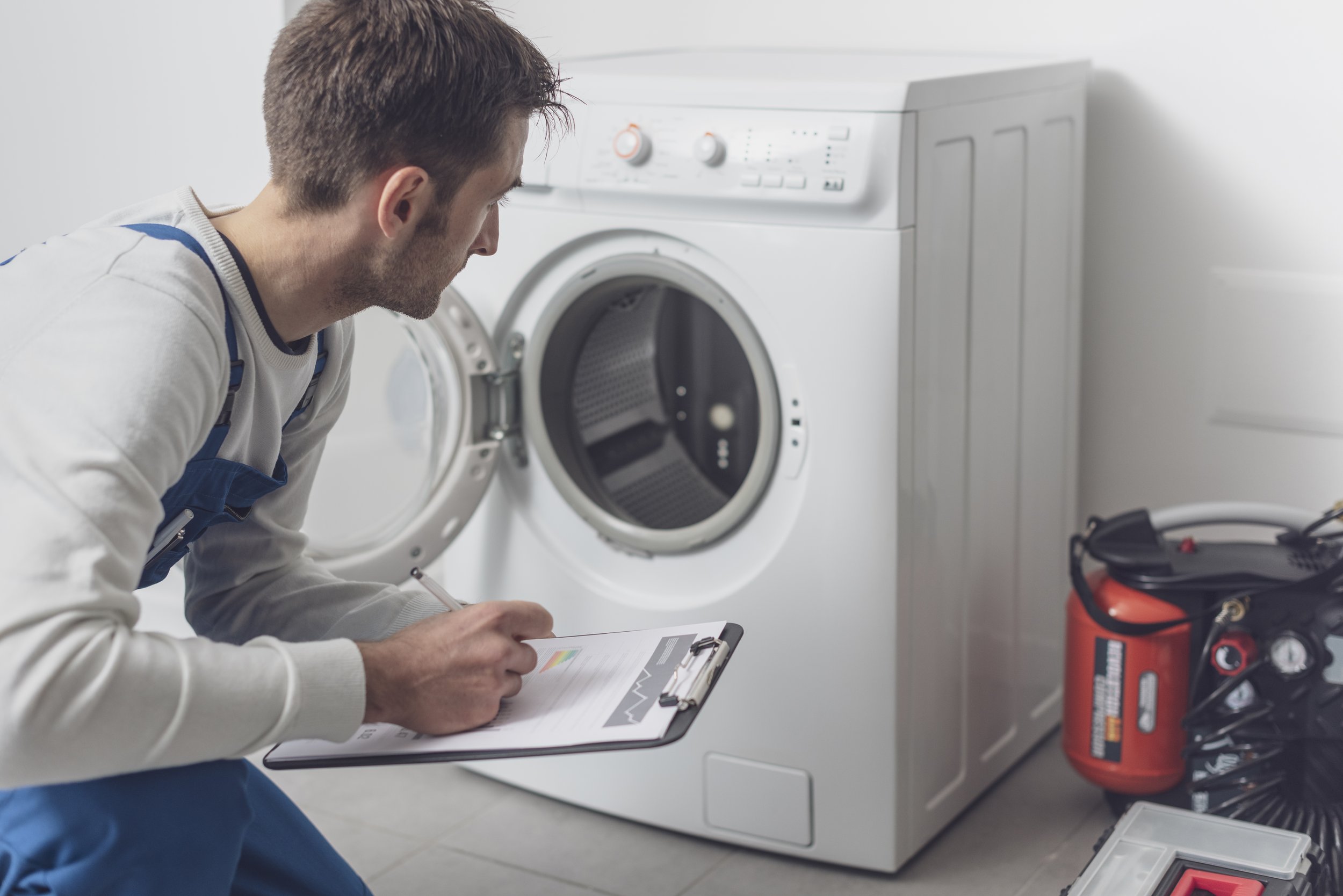 professional-technician-checking-washing-machine.jpg