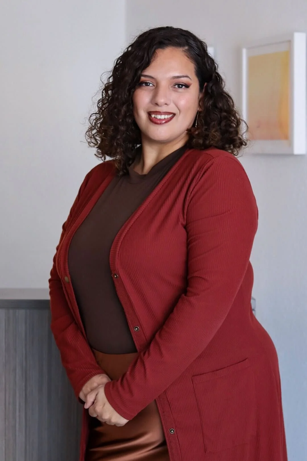 Celinda Mendoza, Therapist-In-Training in a red sweater