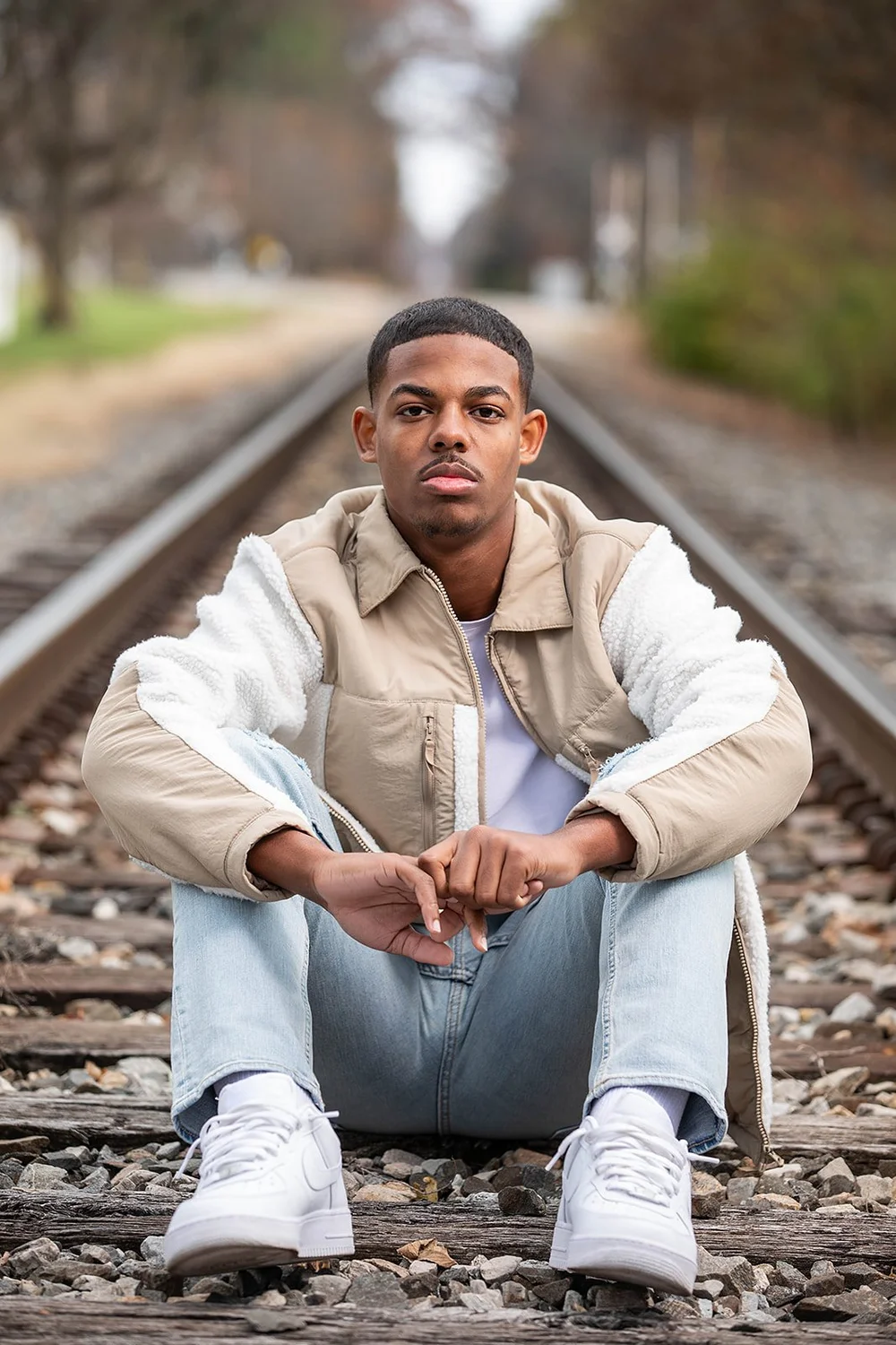 Senior portrait on railroad tracks