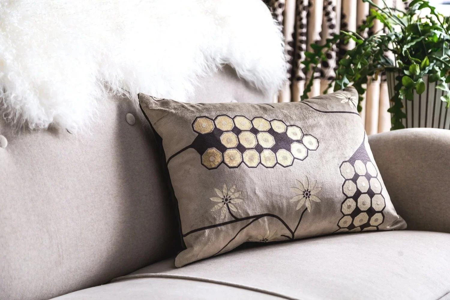 Hollywood Grape cushion styled on a sofa