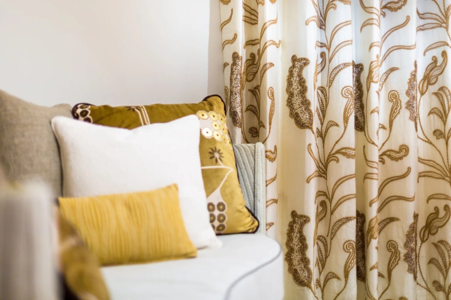 Neisha Crosland fabric styled with cushions