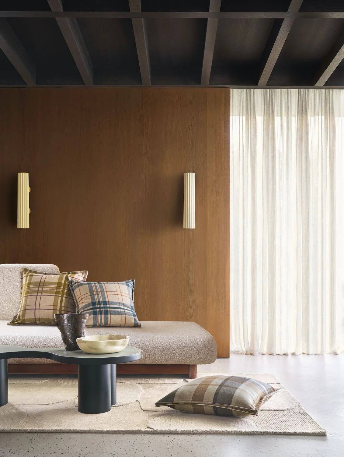 Maison Casamance Highland check cushions in Bleu and Vert on a cream sofa (shared photo, Highland Bleu)