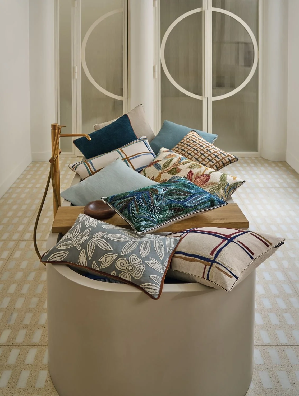 Maison Casamance Oban Bleu Aubergine cushion in a room setting