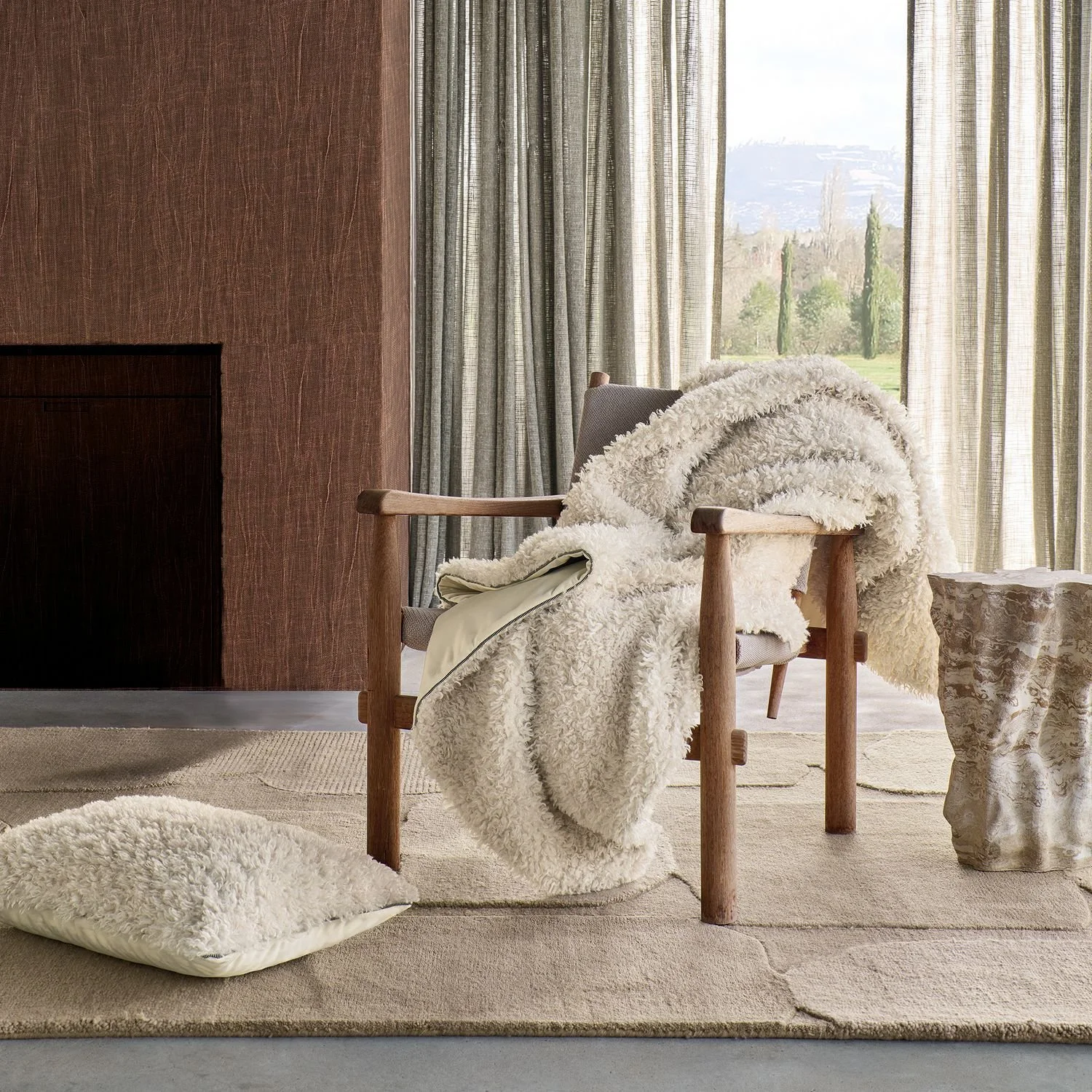 Maison Casamance Sami Ecru cushion in a room setting, wider view