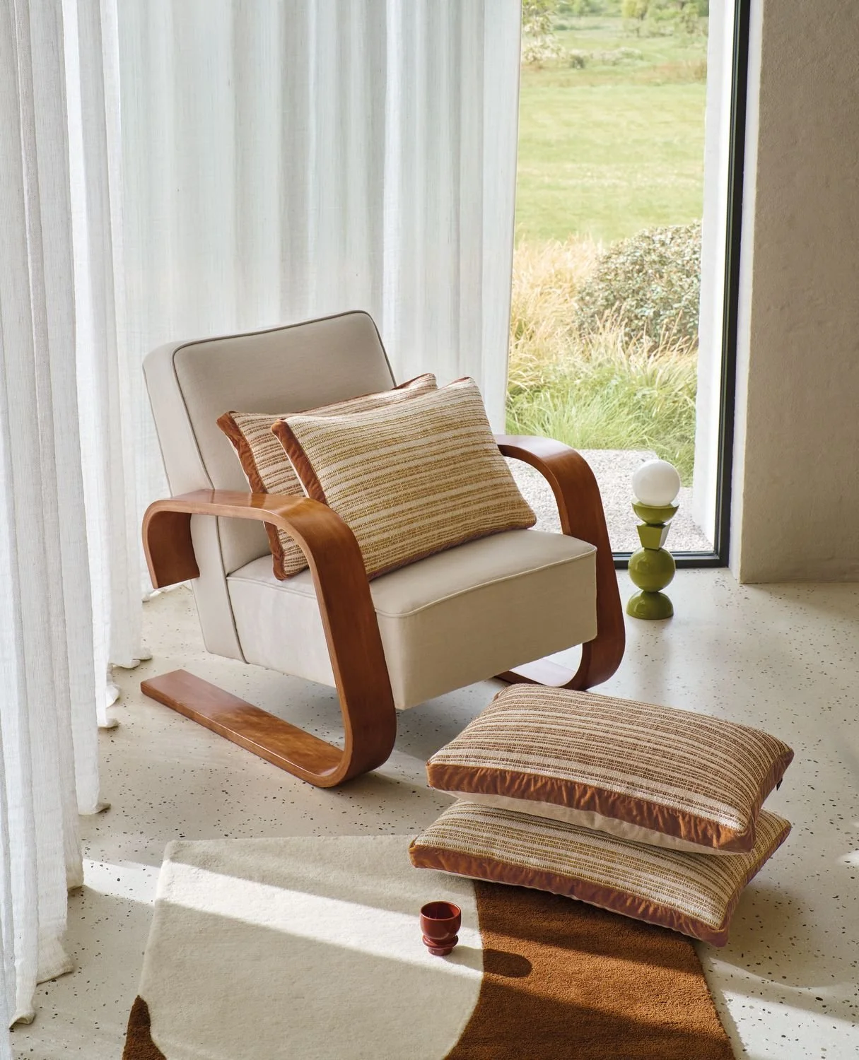 Maison Casamance Haute Lice Ocre cushion in a room setting
