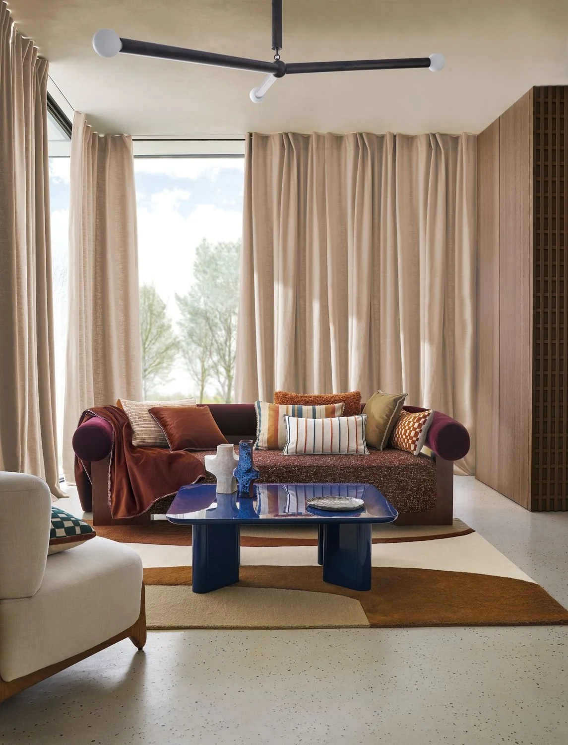 Maison Casamance Sami Orange Brulee cushion in a room setting