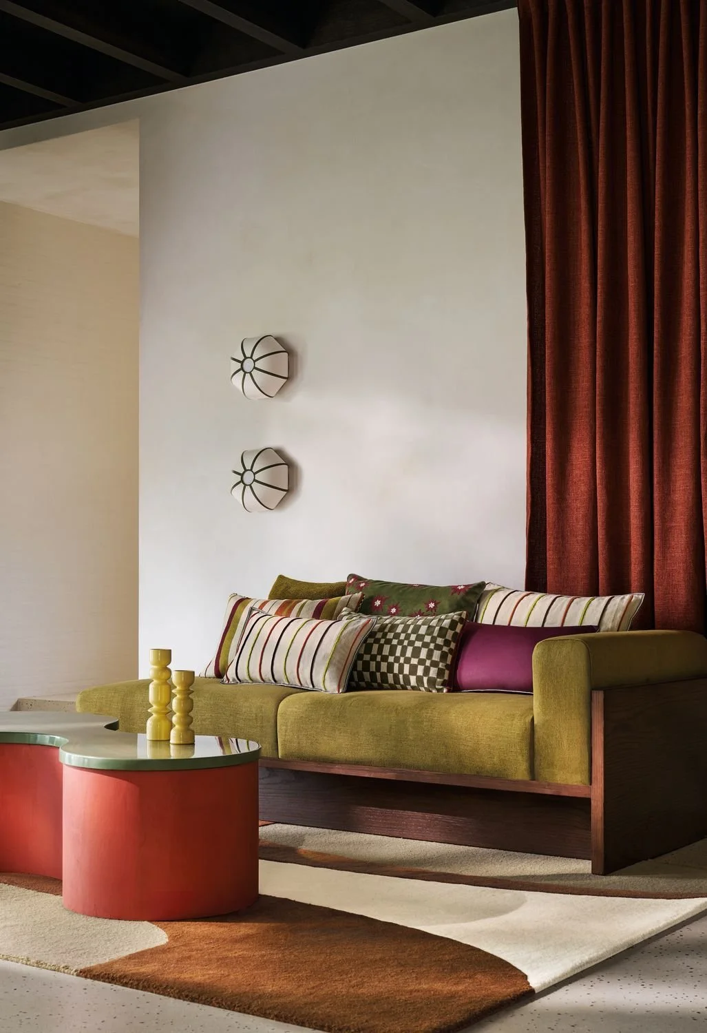 Maison Casamance Elgin Orange Vert cushion in a room setting