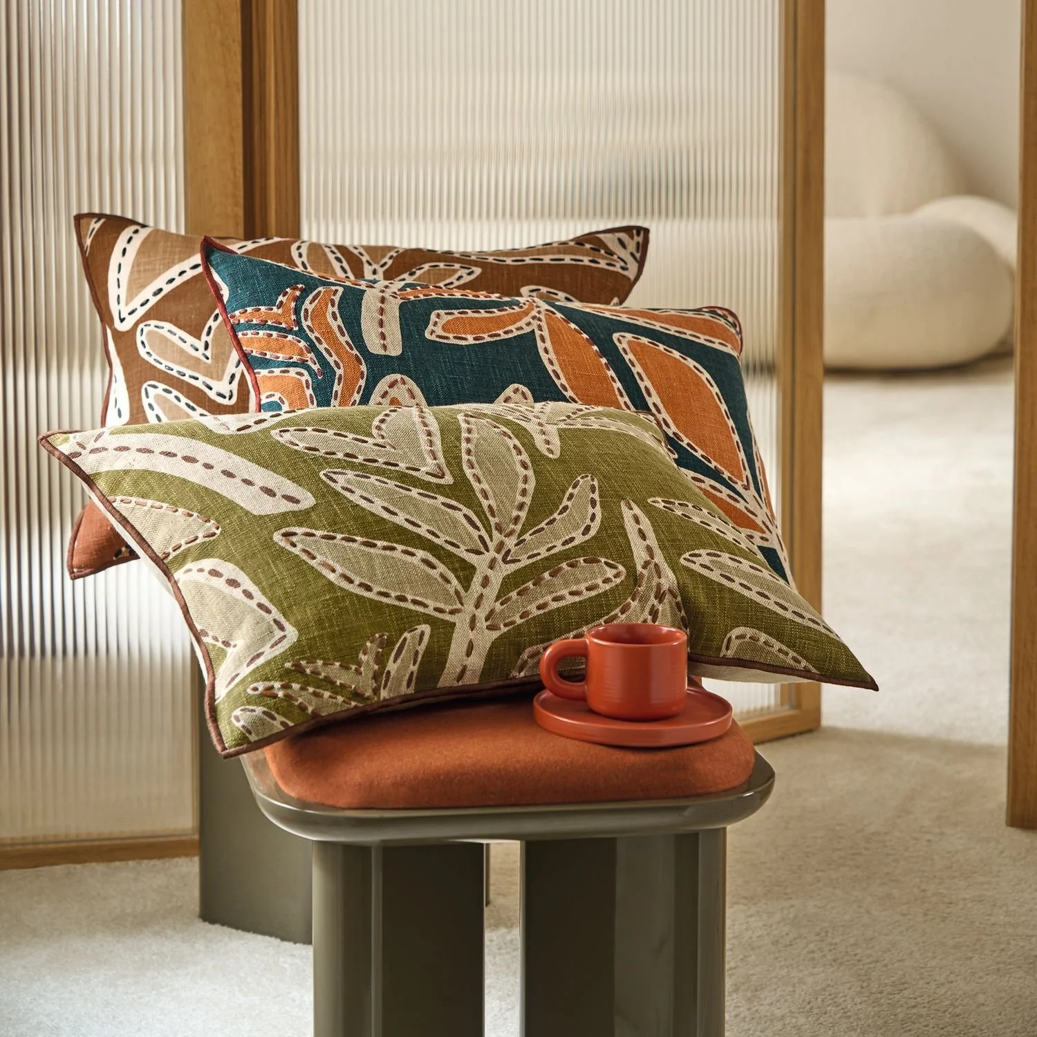 Maison Casamance Padua Beige cushion in a room setting, wider view