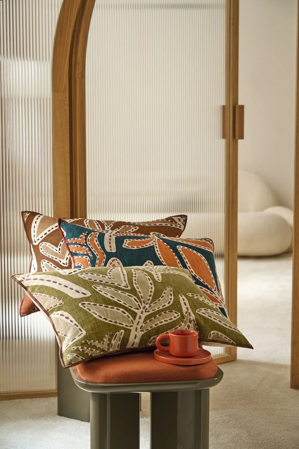 Maison Casamance Padua Vert de Gris cushion in a room setting