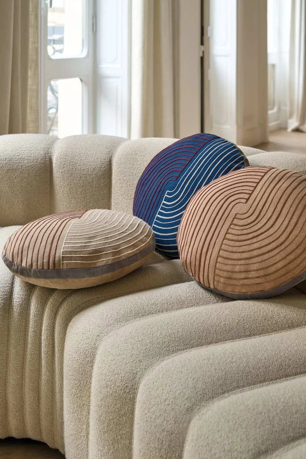Maison Casamance Mellow Alezan round cushion in a room setting