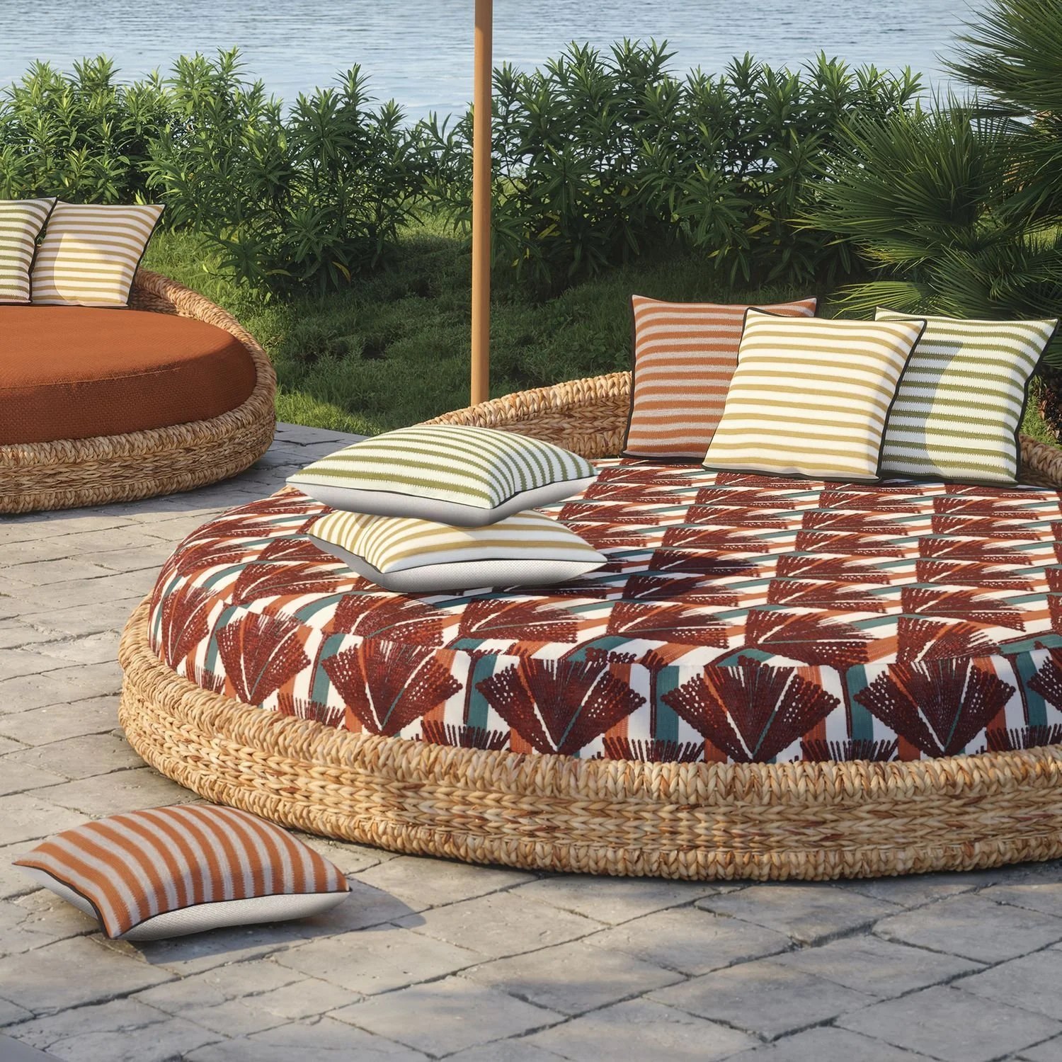 Maison Casamance Levadas Ocre outdoor cushion in a room setting, wider view