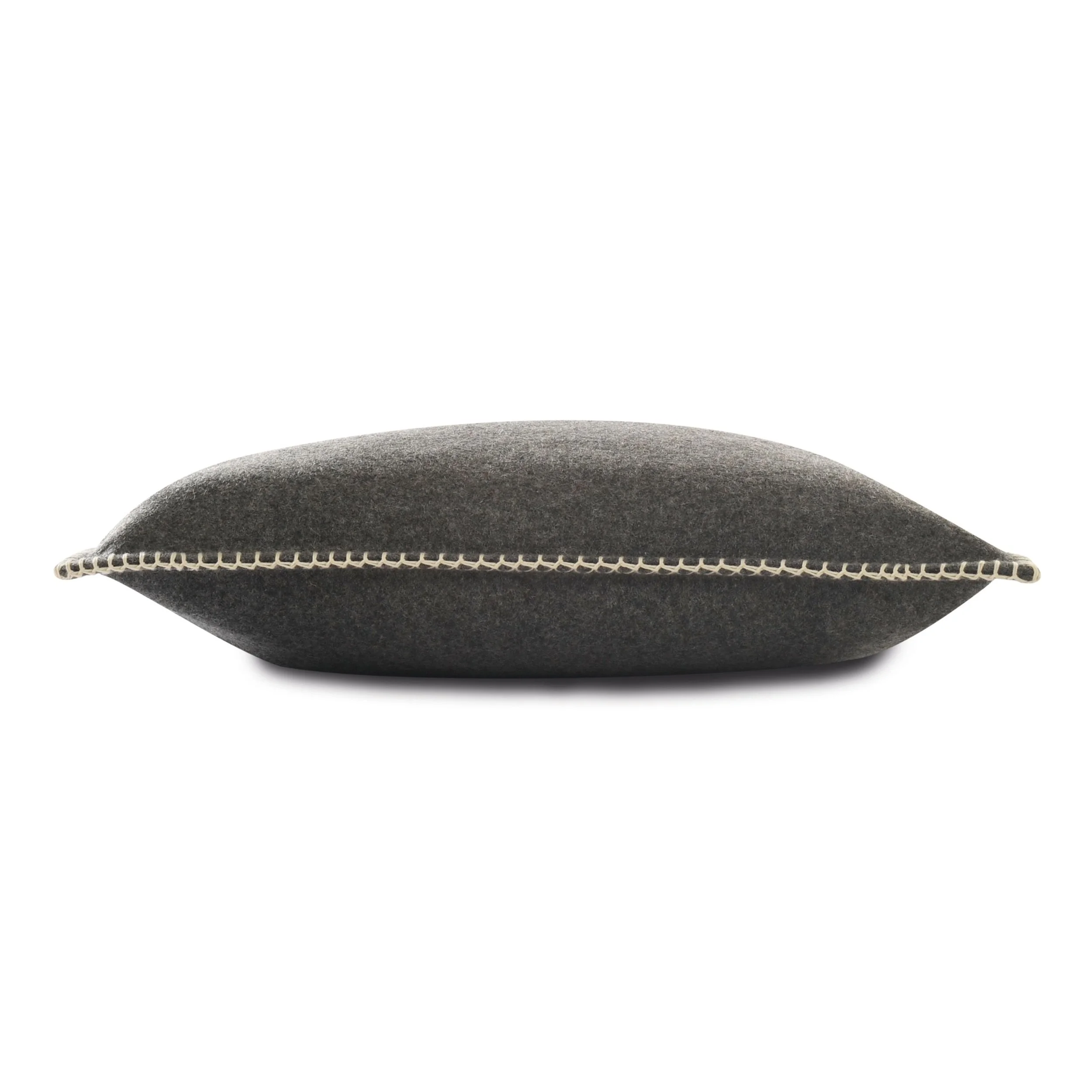 Side view of a Maison Casamance Arthur's Seat cushion showing the blanket stitch edge, shown in Charcoal