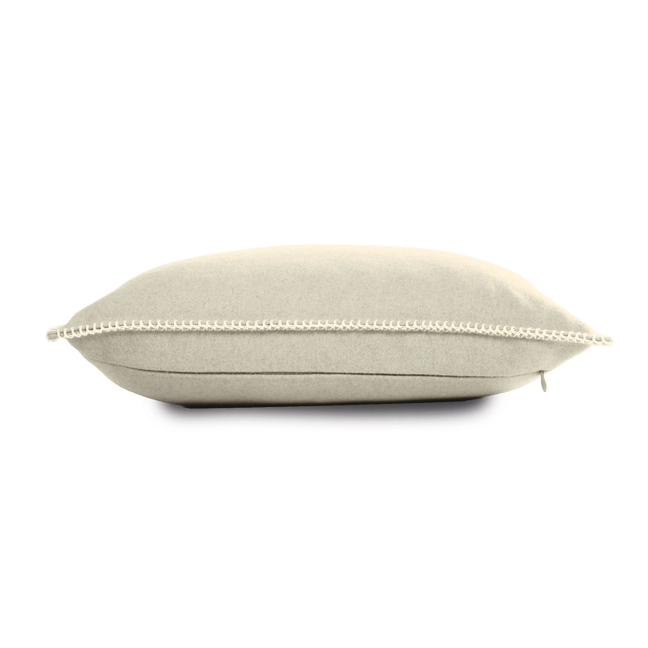 Side view of the Maison Casamance Arthur's Seat Pebble cushion showing the blanket stitch edge
