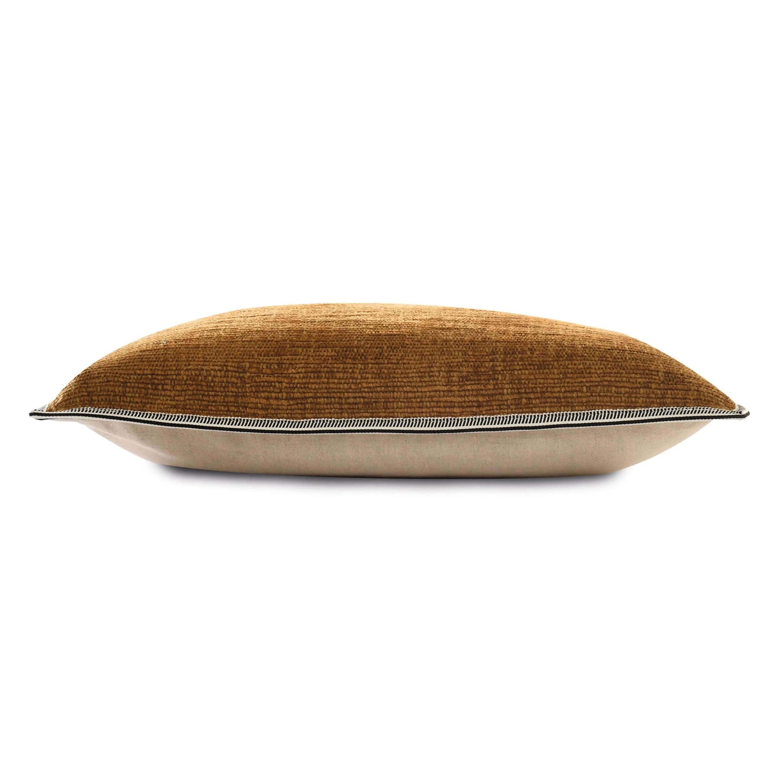 Side view of a Maison Casamance Cabourg cushion showing the braid edge and natural linen reverse, shown in Ambre
