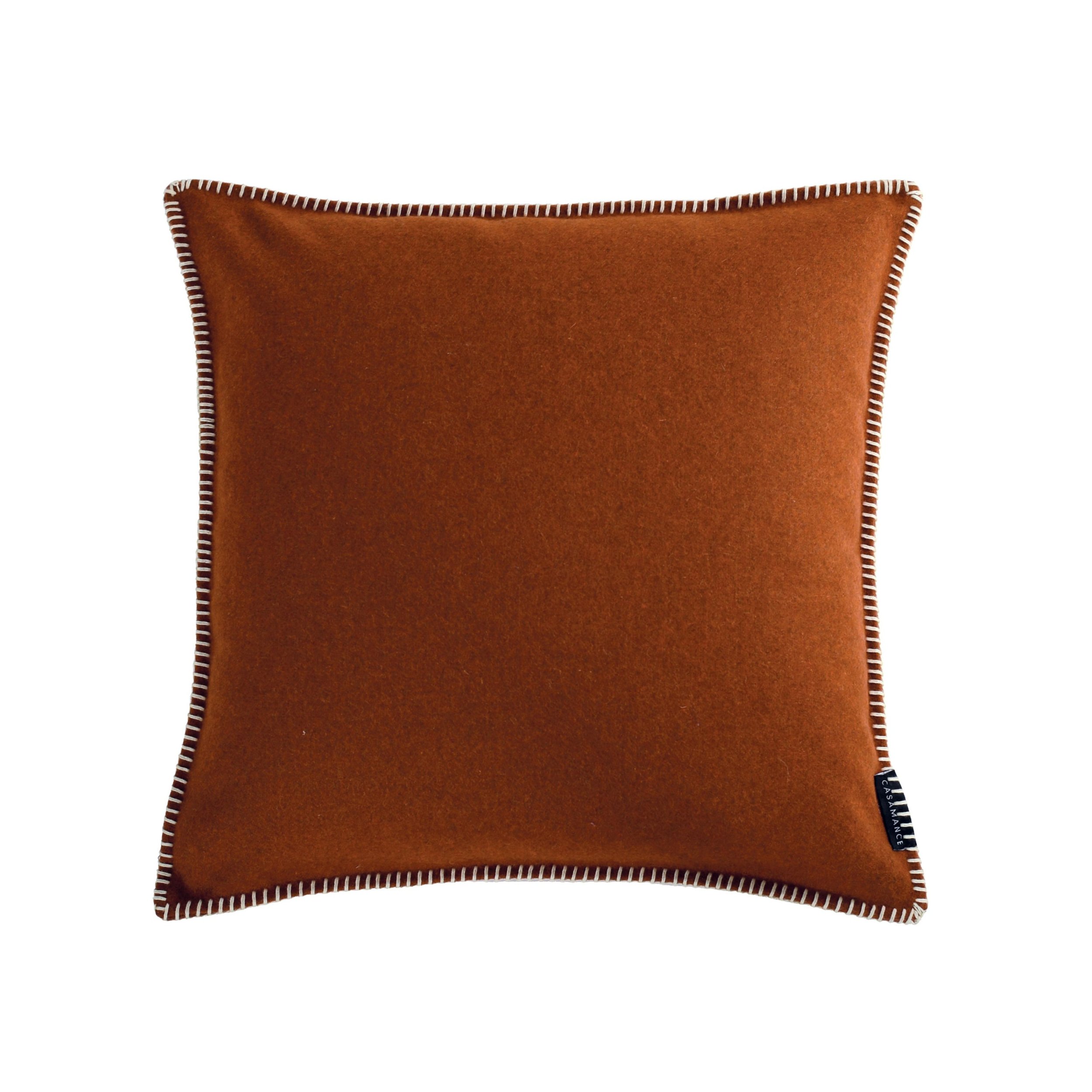 Maison Casamance Arthur's Seat Terre de sienne wool cushion, 45 × 45 cm, with contrast blanket stitch edge, front view