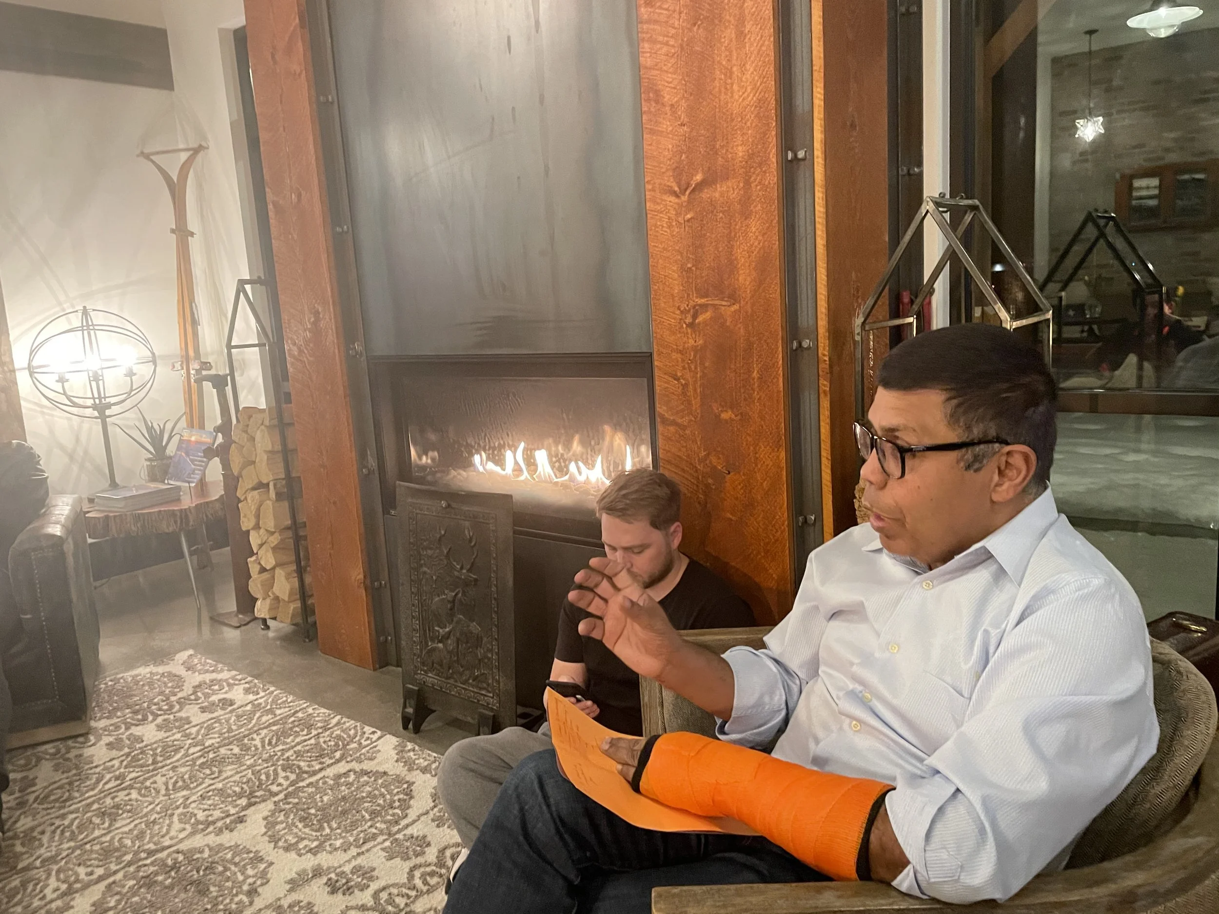 Arjun tells stories at a fireside chat
