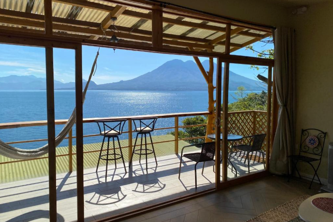 Maya Moon Lodge is one of the best Lake Atitlan Hotels with a proch overlooking the lake and it's surrounding volcanoes