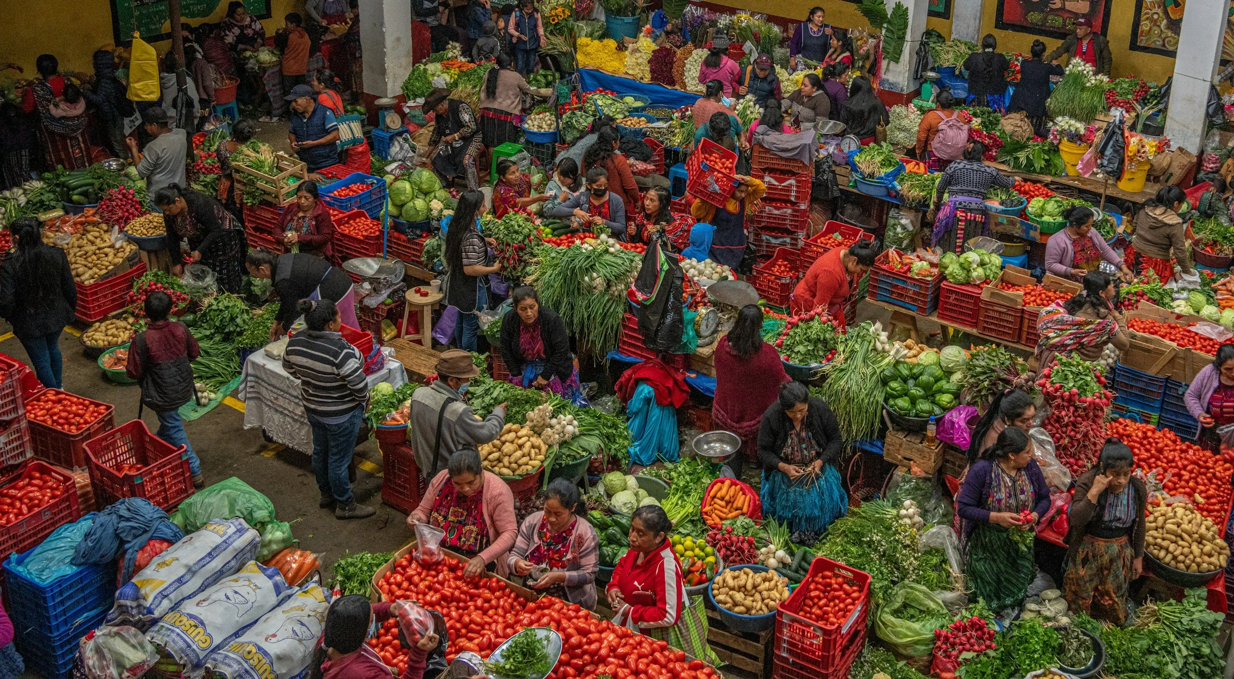 The busy Chichicastenango market with local people shopping, making it one of the best places to visit in Guatemala