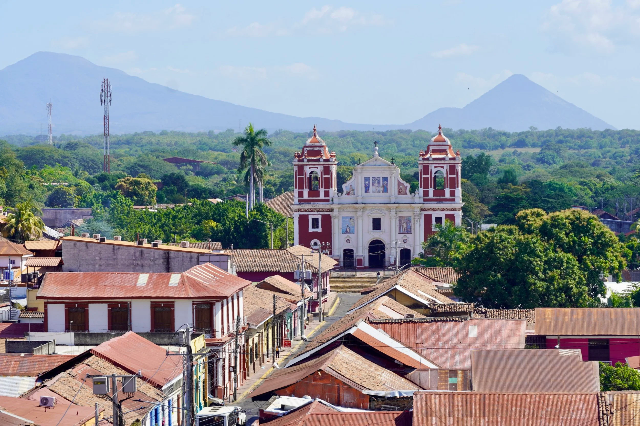 An old church in Leon with volcanoes in the background of Nicaragua