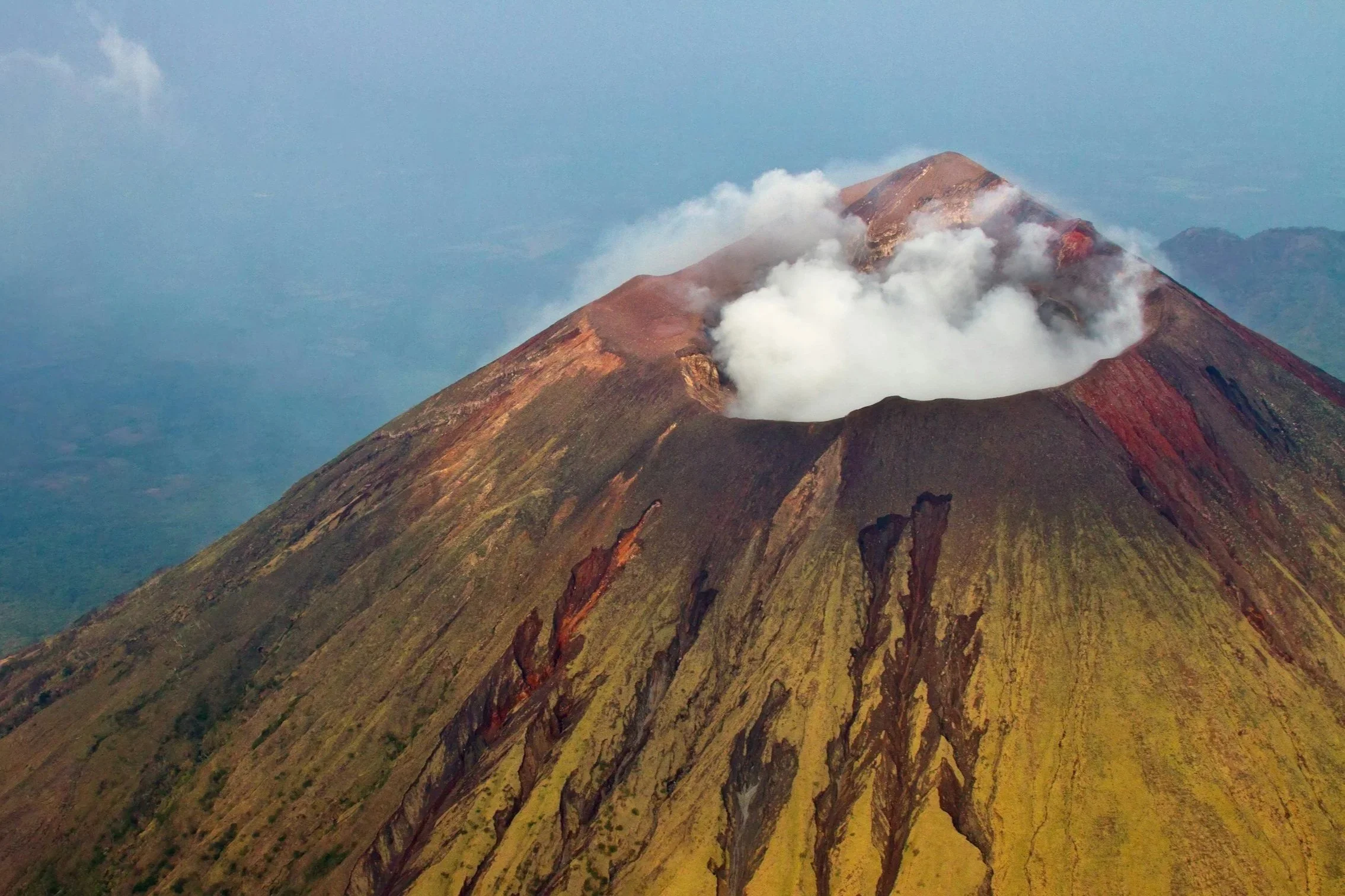 Smoke and ash rise from the top of a volcano in Nicaragua