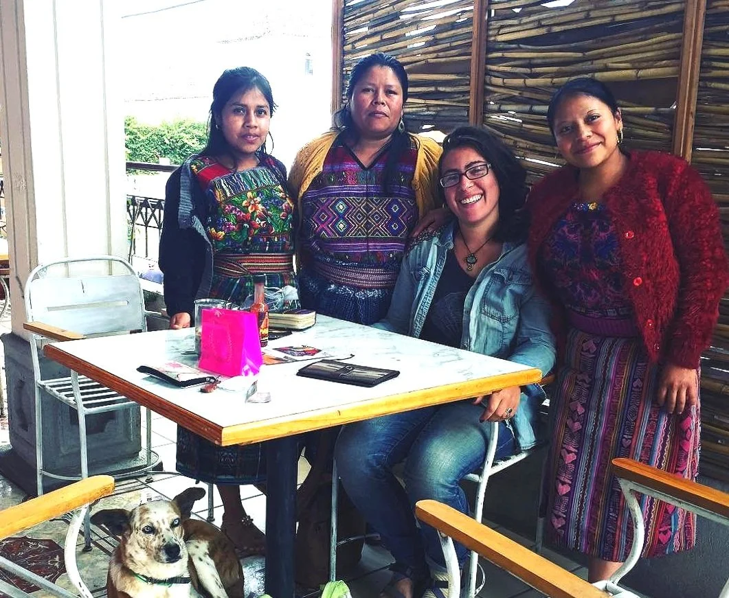 A group of women are smiling for the camera at a nonprofit school while living abroad in Guatemala.