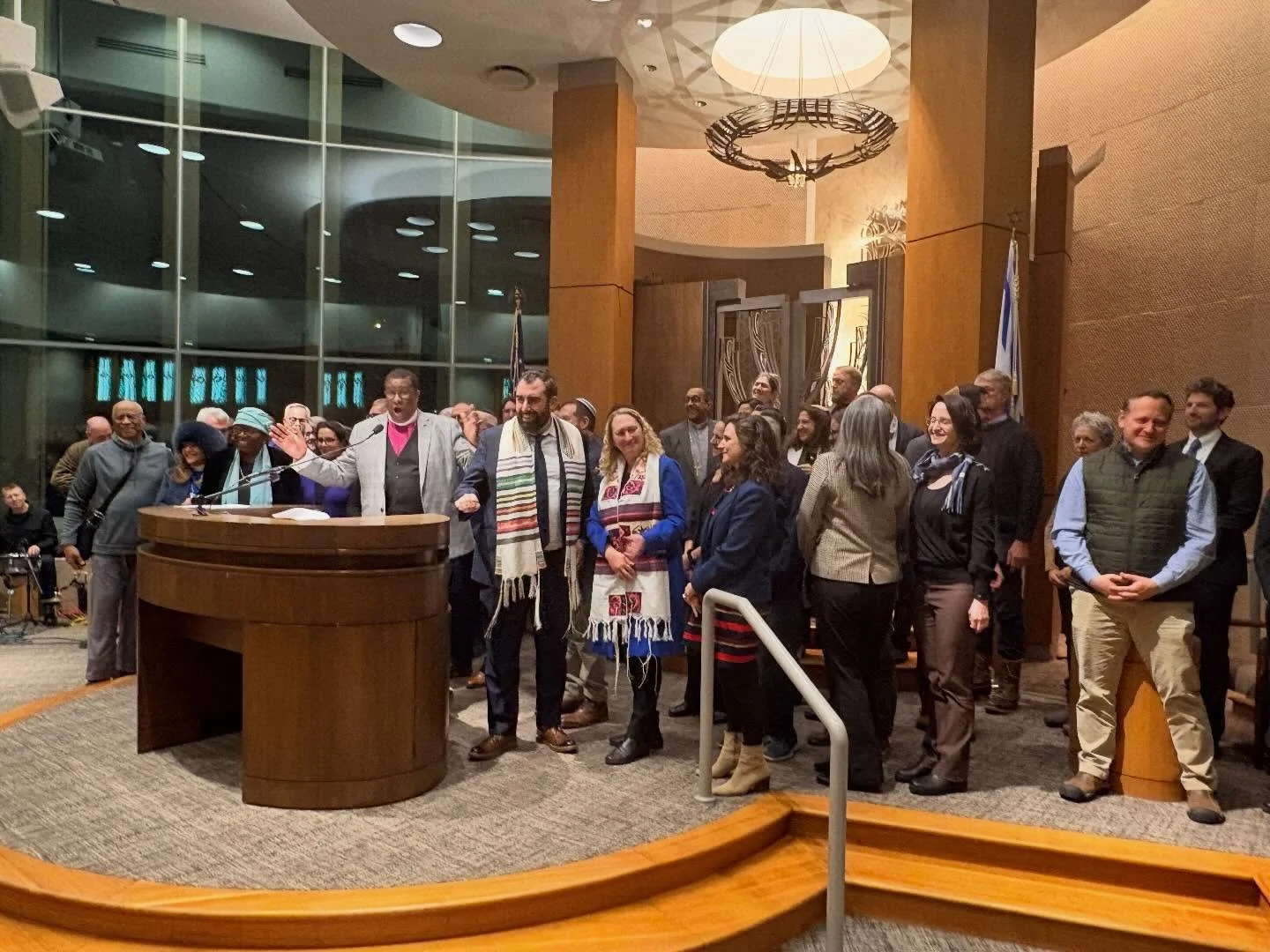 Yesterday, hundreds of community members and dozens of clergy from across the spectrum stood together, literally hand in hand, for a service in support of community and human values. Despite the cold, and in the face of the chaos and violence before 