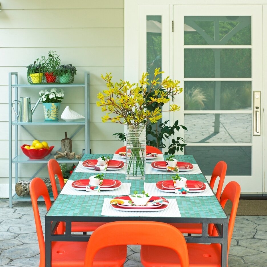 One of my first design projects from way back when. I will always love bright pops of color. They make me happy! From the brightly colored chairs to the fun tiles, this table still looks like a wonderful place to make some memories 🧡 #EmilyLaMarqueD