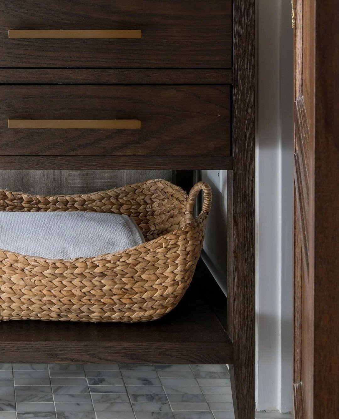 Beautiful storage should work hard, too. Thoughtful bathroom design is all about blending function with warmth &mdash; keeping everyday essentials within reach while making the practical feel intentional. 🤍 #EmilyLaMarqueDesign⁠
⁠
Photography by @ch