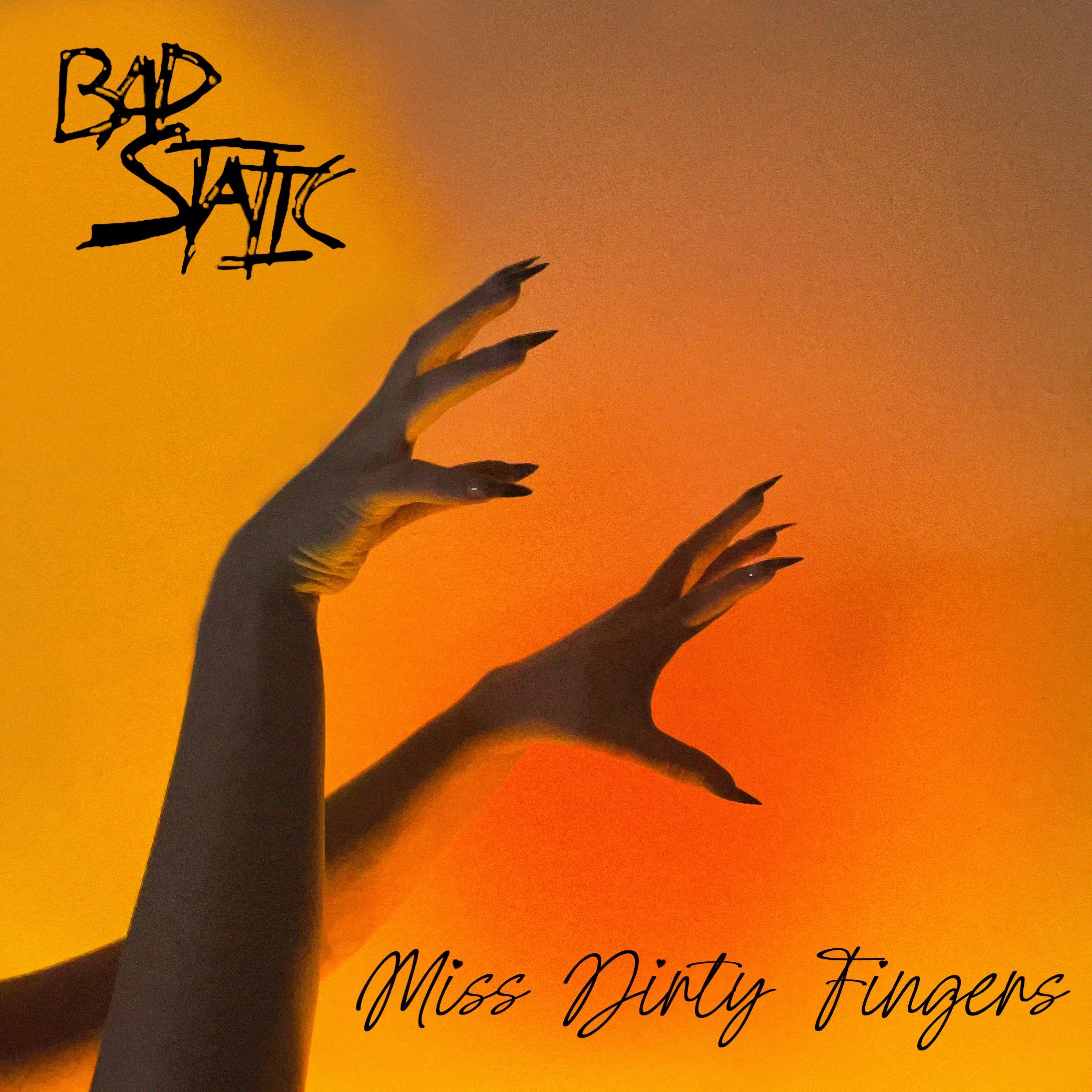 Silhouette of a hand with fingers raised against an orange sunset sky, with decorative text reading 'BAD SATTY' and cursive text 'Miss Dainty Fingers'