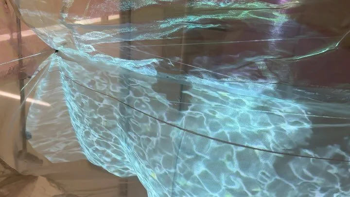 She always replied joone delam, installation of 9 minute film. 
Interview with my mother filmed in the garden of my childhood home. The film is projected onto an iridescent and translucent tapestry made from found materials hung to evoke a body wrapp