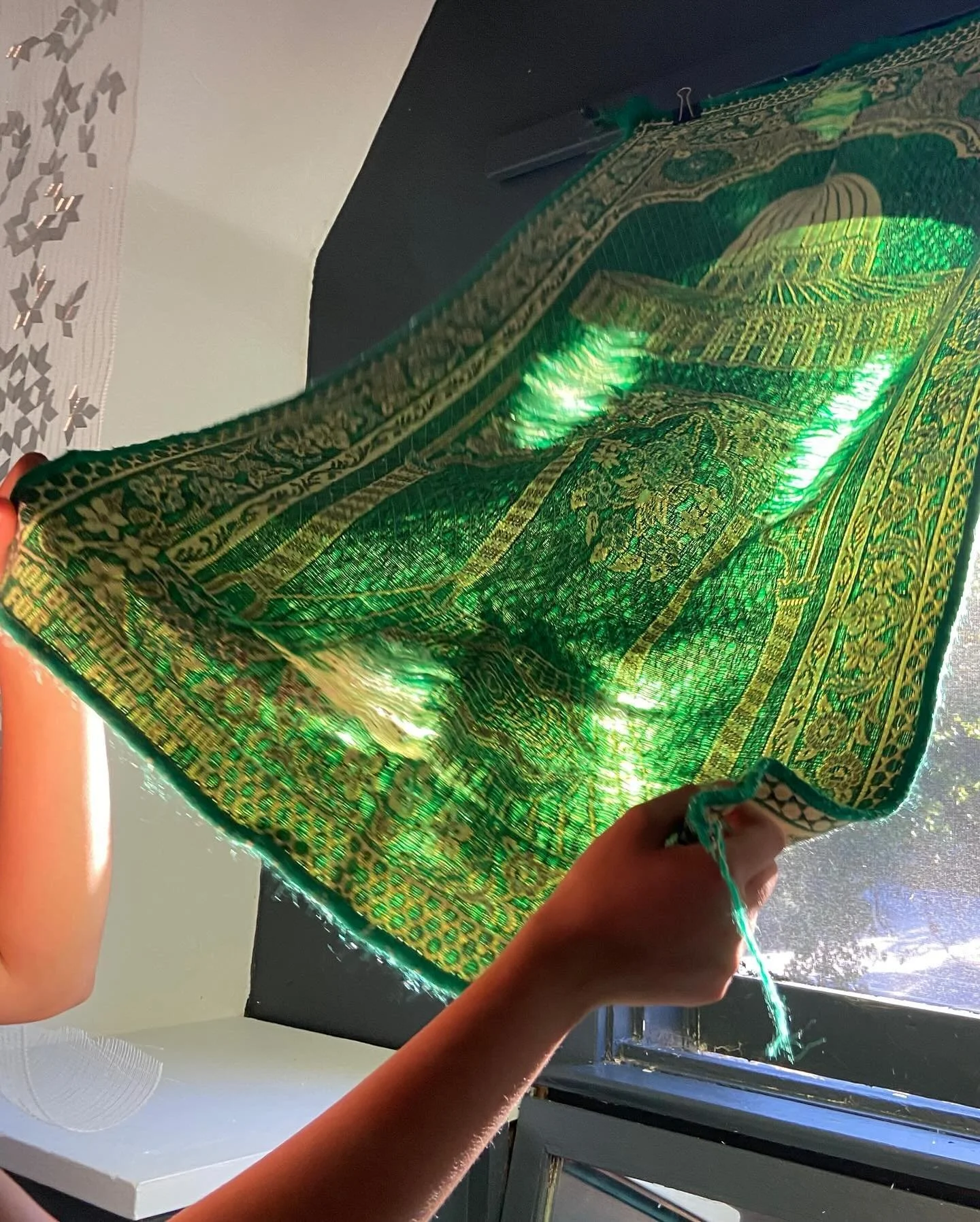 Installation of my father&rsquo;s prayer rug, threadbare in the five points of contact his body had with the rug during his daily prayers. The rug holds the imprint of his devotion and ritual movement over decades (2023)