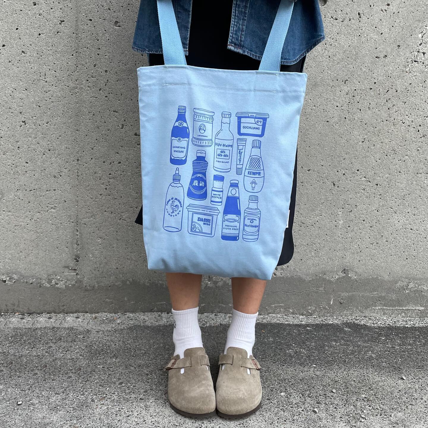 Say hello to the sauce tote 🌶 based off my best-selling print, this bag is perfect way to carry all your pantry essentials. Hand sewn and locally screen-printed with so much love ❤️ 

These bags in pastel blue will be available exclusively at @madei