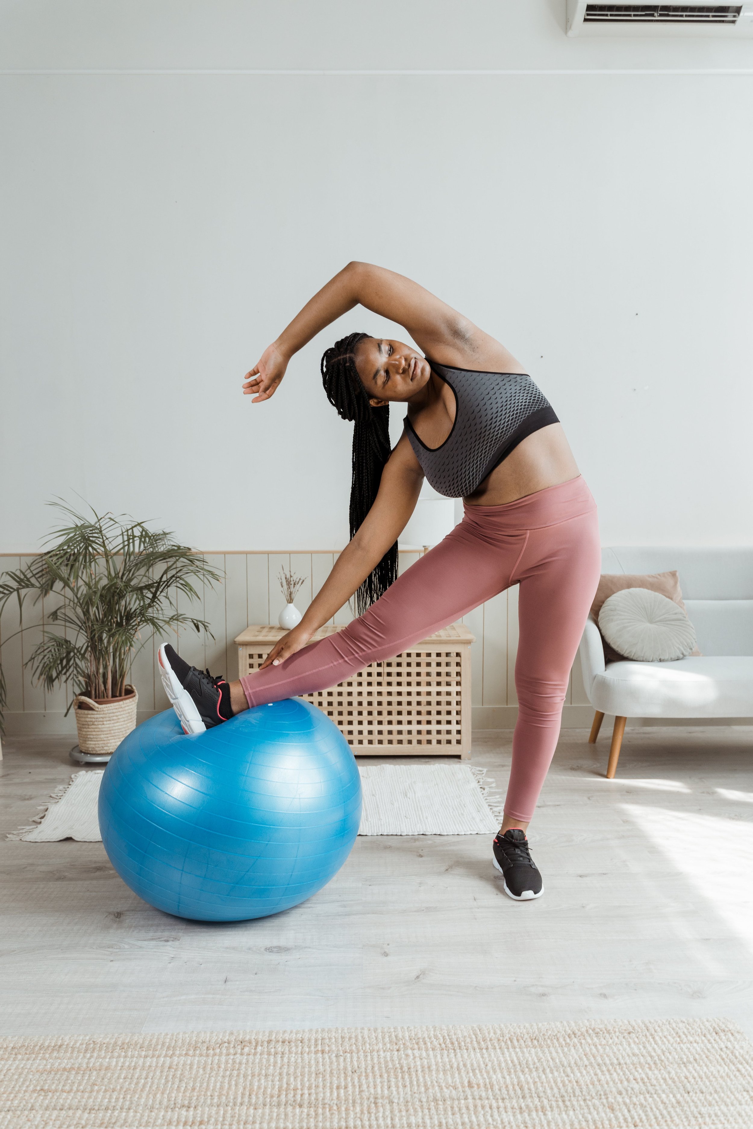 A woman is doing a yoga pose with balls Image & Design ID 0000294899 -  SmileTemplates.com