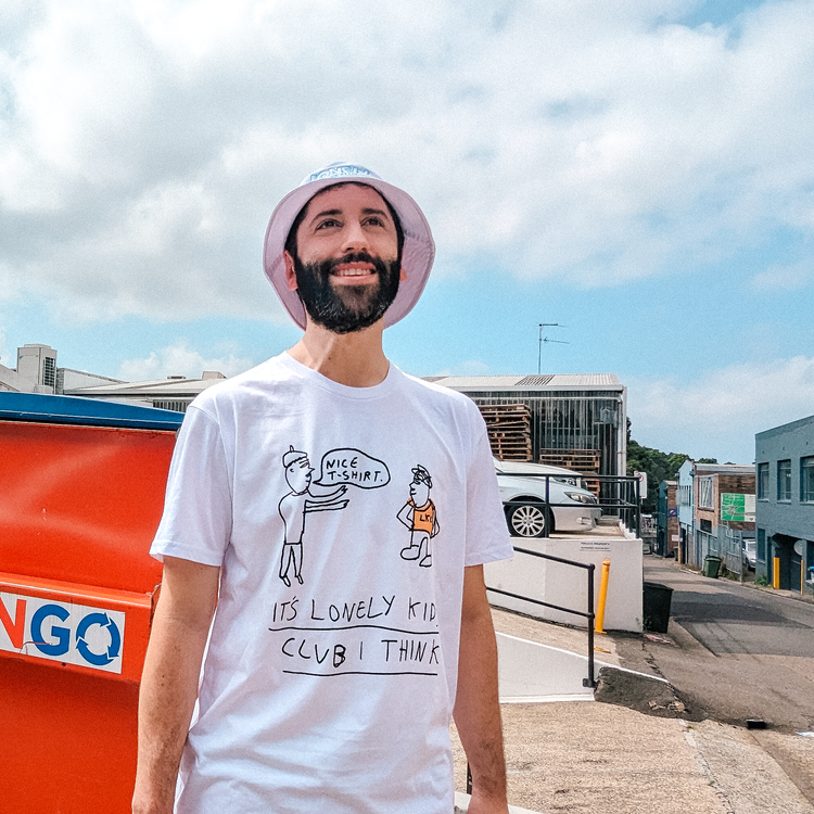 Person in a bucket hat wearing a printed T-shirt