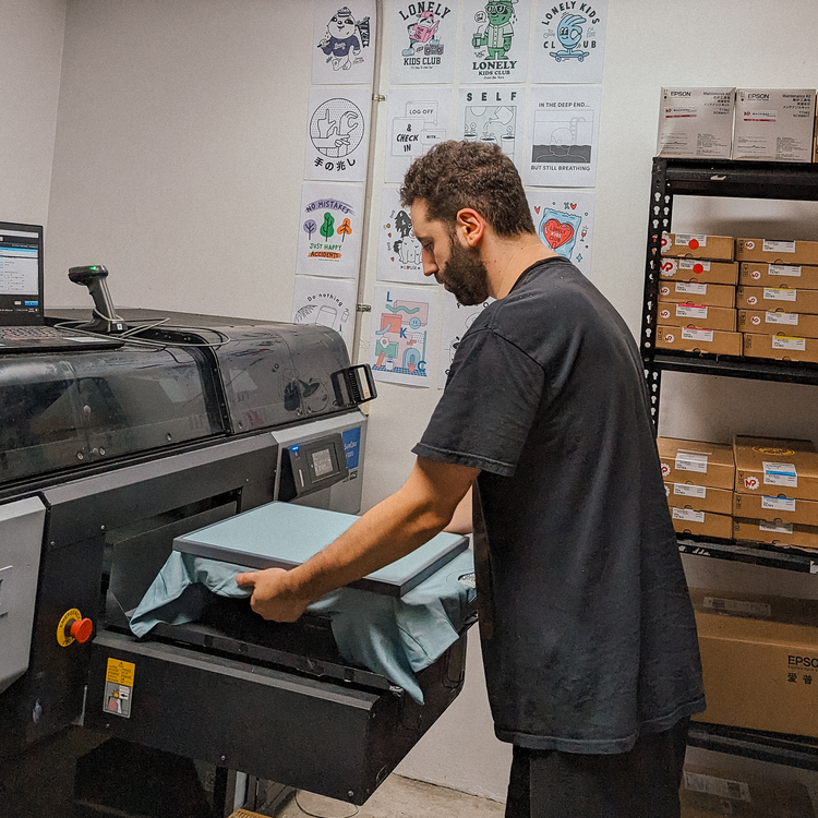 Loading a shirt into the DTG printer in the Artarmon studio
