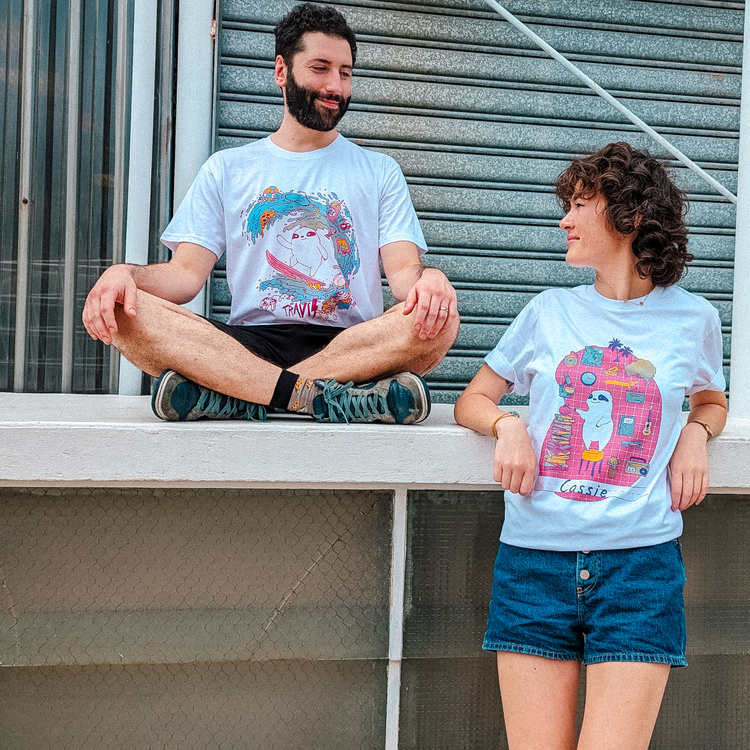 Two people wearing printed T-shirts outdoors