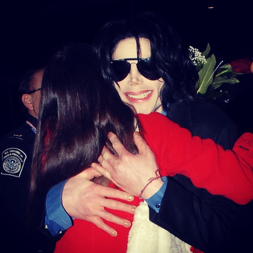 A beautiful smile: Michael holding me in his arms at Los Angeles International Airport, where I went to greet him on his return from London in March 2007. Read what happened moments later, when he invited me into his SUV for a chat, in my new memoir,
