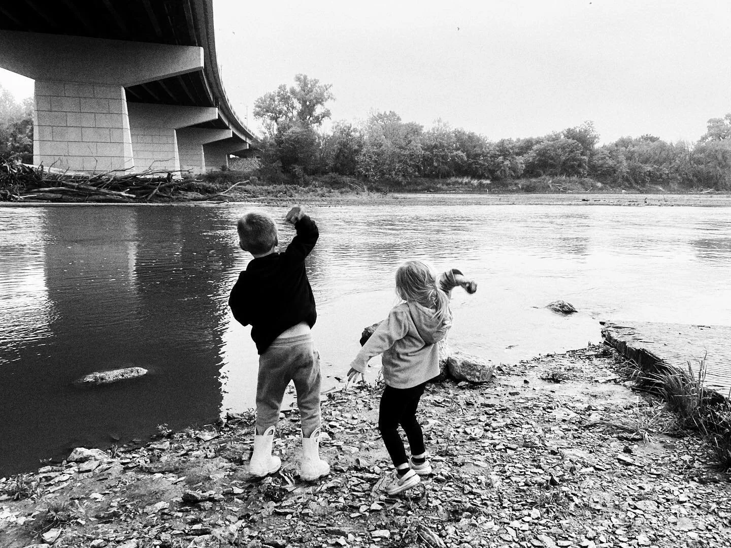 Throwing rocks in the river. 
.
#kansaslife