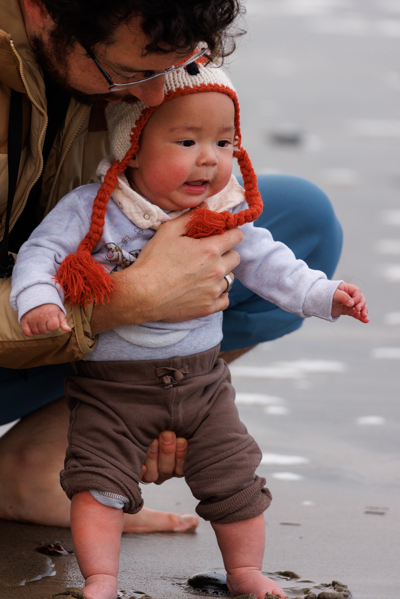 First time touching the sand at the beach! 4 months old.