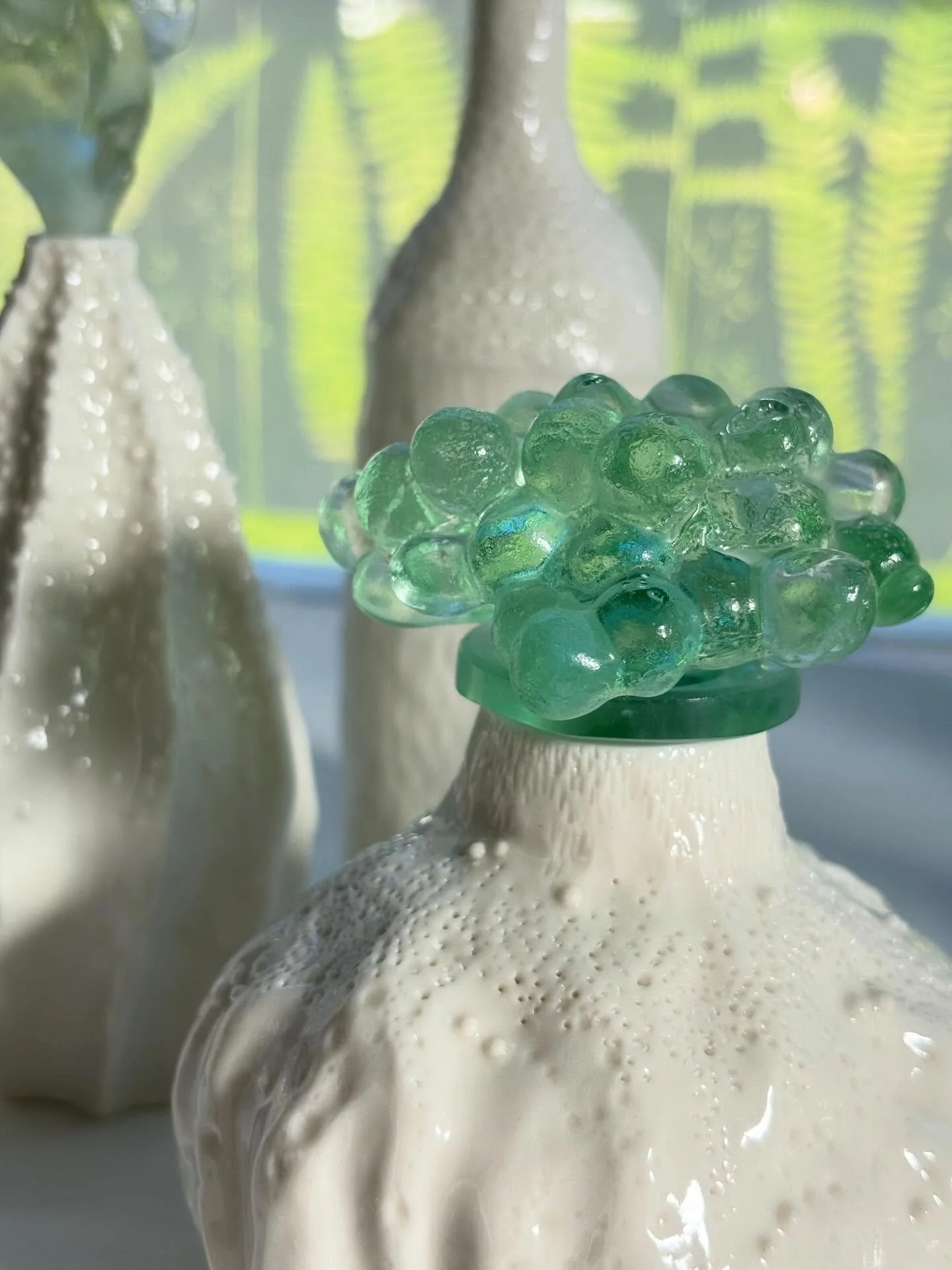 I&rsquo;m really falling in love with ceramics and porcelain in particular. Combining it with glass makes me very happy. Evening sunlight making the glass stoppers hold the light inside them which only the magical material of glass can do.
Pieces are