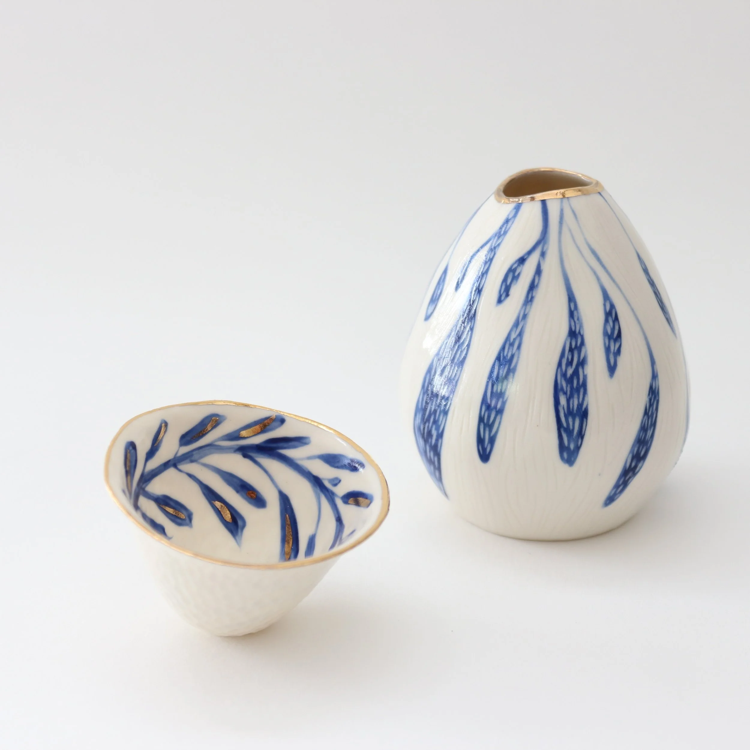 New porcelain pieces. I just love making this new work. It allows me to play with mark making and design in new ways. 
They are slipcast, then carved with subtle texture, painted with seaweed designs and finally gold lustred detail is added. They tak