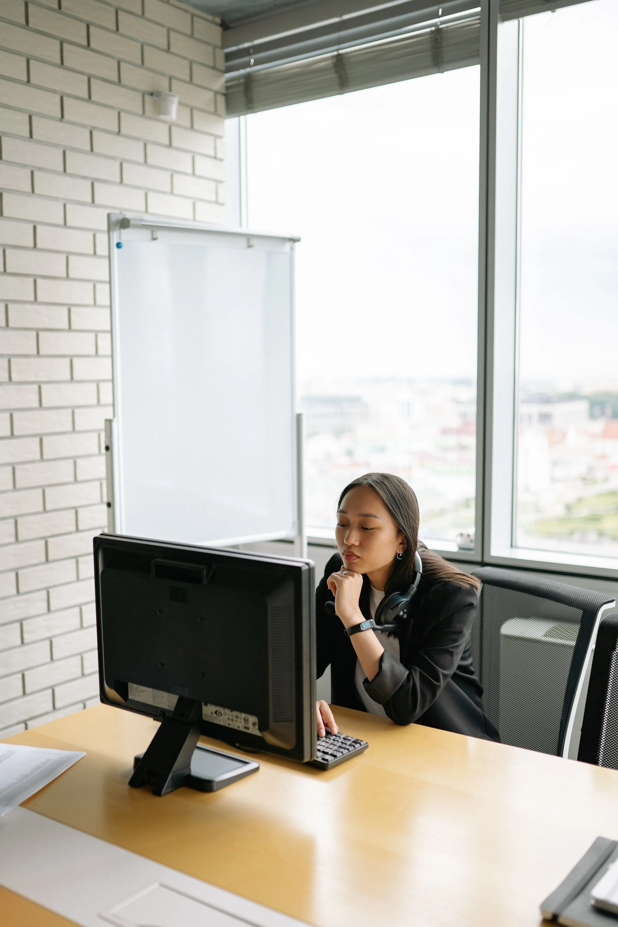 Woman sitting at desk procrastinating