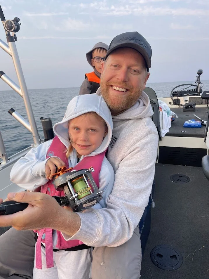 Reeling in salmon on Lake Michigan
