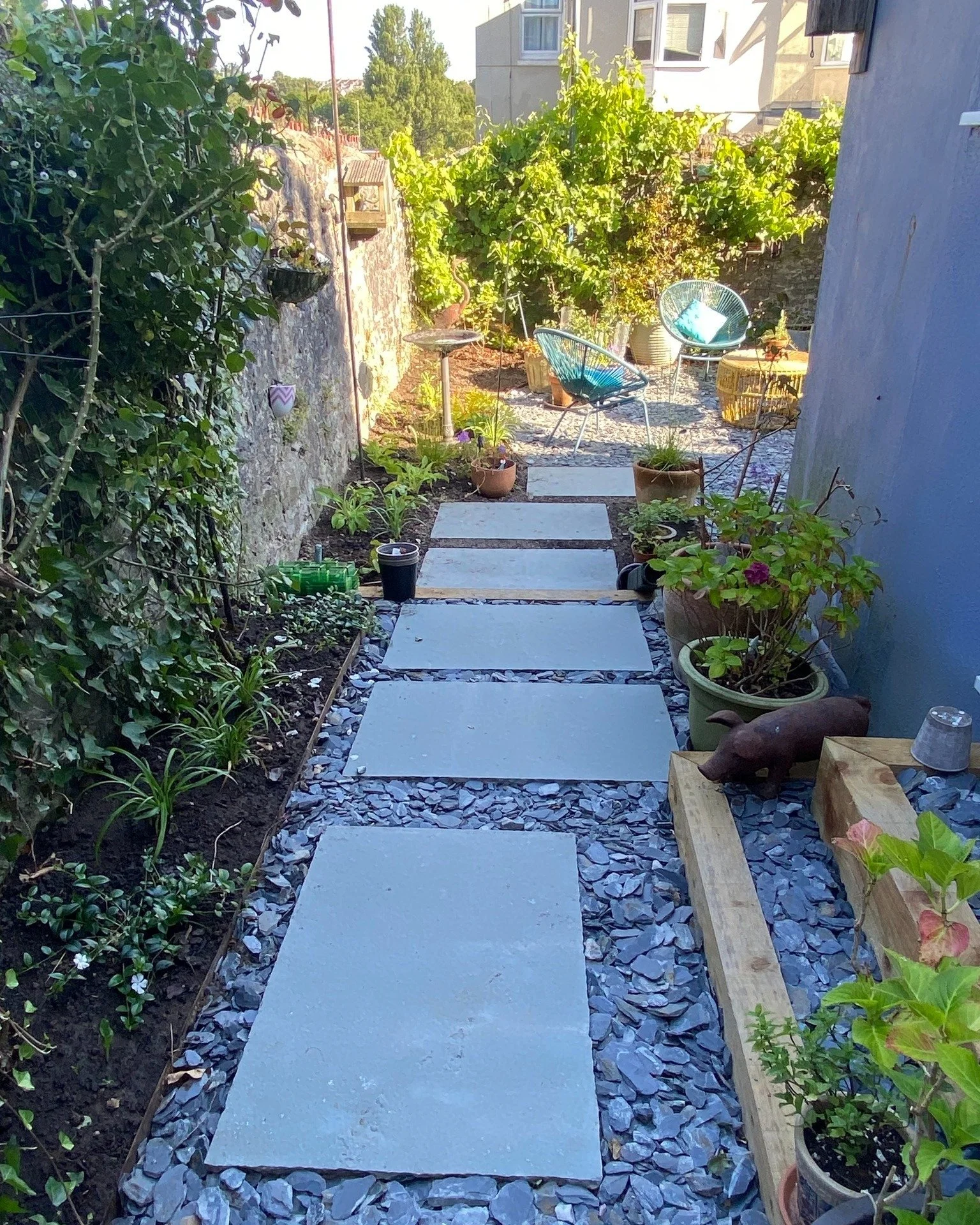It is always a pleasure to see a client move back into their space and make it their own with much-loved pots and garden art.  These &lsquo;after' views, kindly provided by my client who took on the planting herself, show the Small Sanctuary Garden i